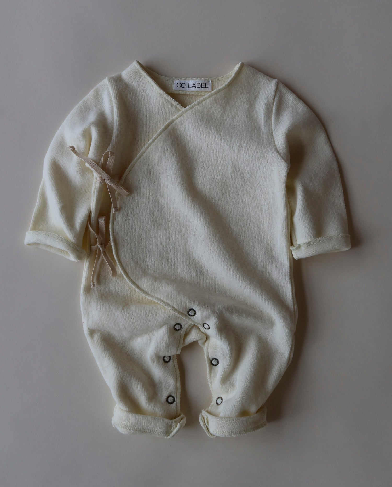 WARM EDDIE BABYSUIT - CO LABEL